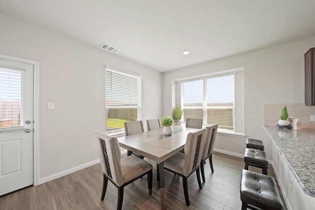 5330 Briana Dee Dr, Rosharon, TX 77583 - dining space with light wood-style flooring and baseboards