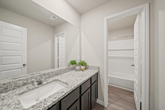 5330 Briana Dee Dr, Rosharon, TX 77583 - full bath featuring vanity, wood finished floors, and baseboards