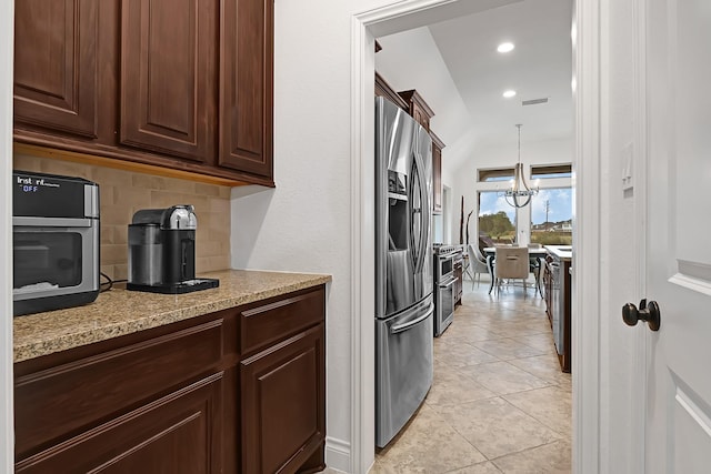 4003 N Creekmont Dr, Fresno, TX 77545 - kitchen featuring stainless steel fridge with ice dispenser, decorative backsplash, dark brown cabinets, decorative light fixtures, and light tile patterned flooring