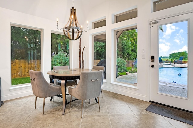 4003 N Creekmont Dr, Fresno, TX 77545 - dining room with a chandelier, baseboards, and light tile patterned floors