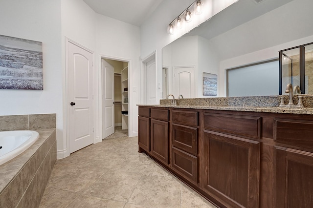 4003 N Creekmont Dr, Fresno, TX 77545 - bathroom with double vanity, a garden tub, and a closet