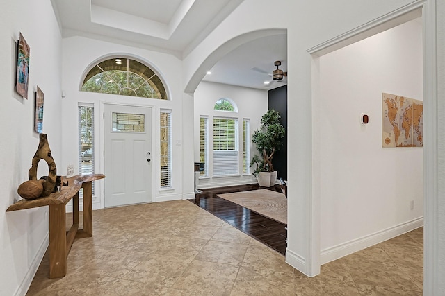 4003 N Creekmont Dr, Fresno, TX 77545 - entryway featuring ceiling fan, baseboards, recessed lighting, arched walkways, and a raised ceiling