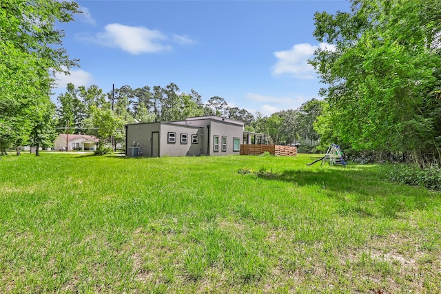 538 Magnolia Point Dr, Huffman, TX 77336 - view of yard featuring central AC