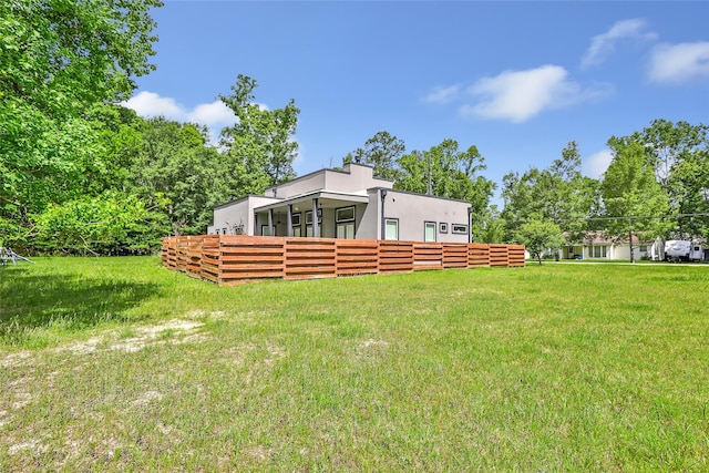 538 Magnolia Point Dr, Huffman, TX 77336 - rear view of property with stucco siding and a yard