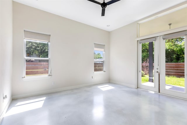 538 Magnolia Point Dr, Huffman, TX 77336 - unfurnished room featuring french doors, healthy amount of natural light, concrete floors, and ceiling fan