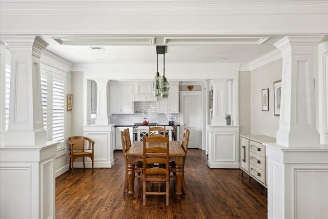 446 Arlington St, Houston, TX 77007 - dining room featuring decorative columns, dark wood-style floors, and crown molding