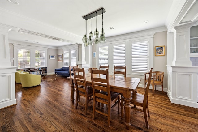 446 Arlington St, Houston, TX 77007 - dining space featuring decorative columns, dark wood-style flooring, baseboards, and ornamental molding