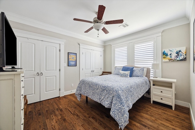 446 Arlington St, Houston, TX 77007 - bedroom with multiple closets, baseboards, dark wood-style floors, crown molding, and a ceiling fan