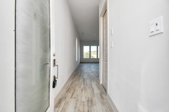 4016 Boho Ln, Houston, TX 77045 - hallway featuring light wood finished floors and baseboards