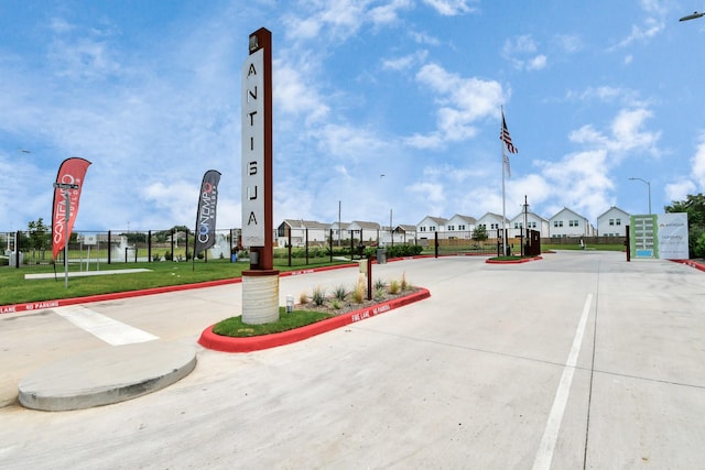 4016 Boho Ln, Houston, TX 77045 - view of concrete road featuring street lighting, curbs, and a residential view