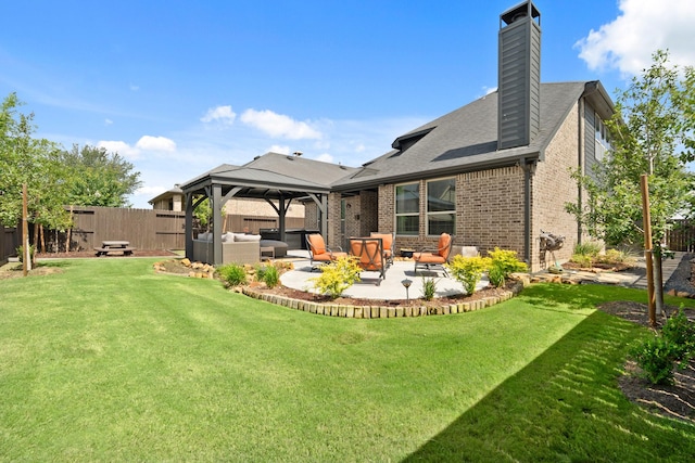 3638 Long Flower Ct, Fulshear, TX 77441 - back of property with an outdoor living space, a gazebo, a patio area, brick siding, and a chimney