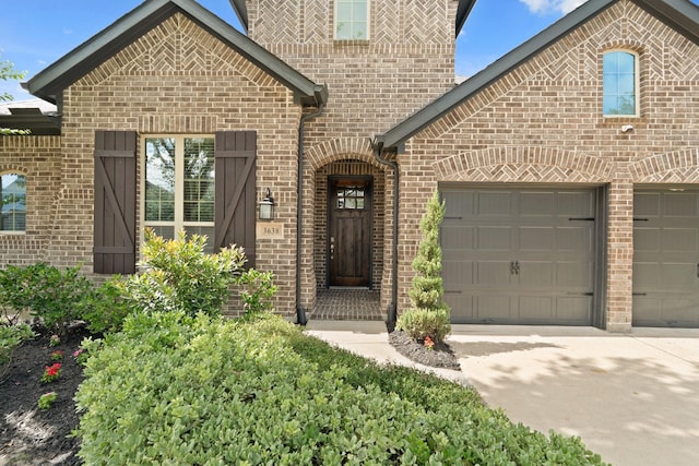 3638 Long Flower Ct, Fulshear, TX 77441 - view of front of home featuring brick siding, driveway, and a garage
