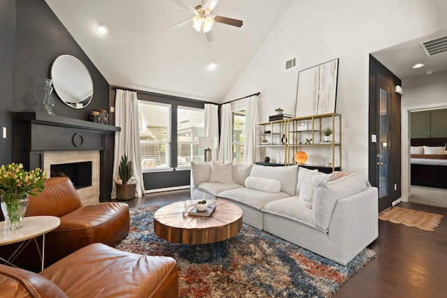 3638 Long Flower Ct, Fulshear, TX 77441 - living room featuring high vaulted ceiling, wood finished floors, a ceiling fan, a fireplace, and baseboards