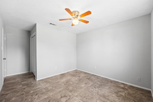 9918 Enchanted Stone Dr, Houston, TX 77070 - spare room featuring ceiling fan, baseboards, and a textured ceiling