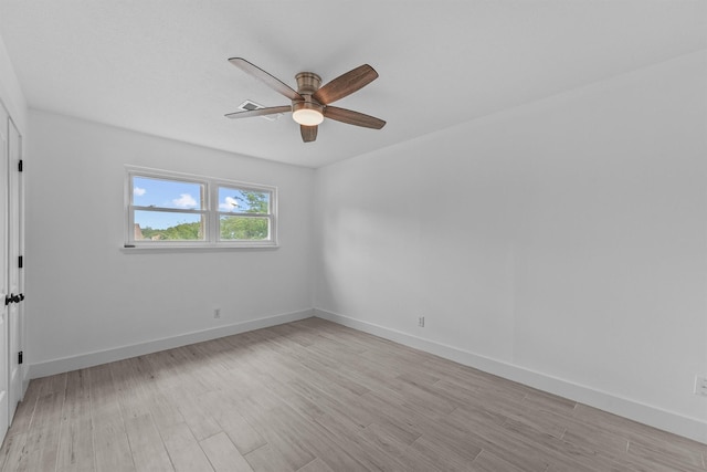 1323 Warwickshire Dr, Houston, TX 77077 - spare room featuring a ceiling fan, light wood-type flooring, and baseboards