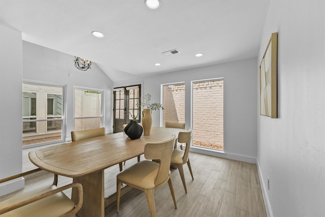 1323 Warwickshire Dr, Houston, TX 77077 - dining room featuring baseboards, recessed lighting, light wood-style floors, and lofted ceiling