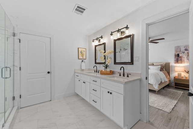 1323 Warwickshire Dr, Houston, TX 77077 - full bathroom with double vanity, ensuite bathroom, a stall shower, and ceiling fan