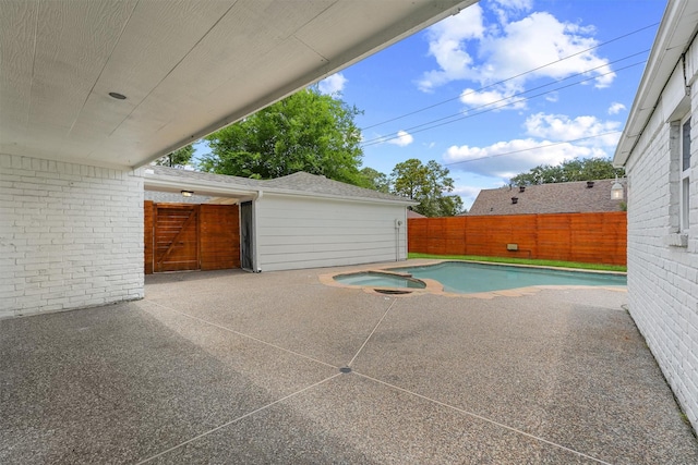 1323 Warwickshire Dr, Houston, TX 77077 - view of swimming pool with a patio area, a fenced backyard, and a pool with connected hot tub
