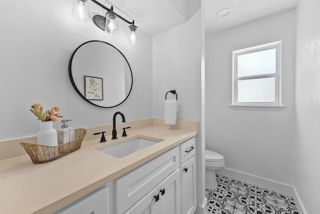 1323 Warwickshire Dr, Houston, TX 77077 - bathroom featuring toilet, tile patterned floors, vanity, and baseboards