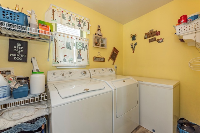 811 Hackberry Ln, Friendswood, TX 77546 - laundry area featuring washer and dryer and wood finished floors
