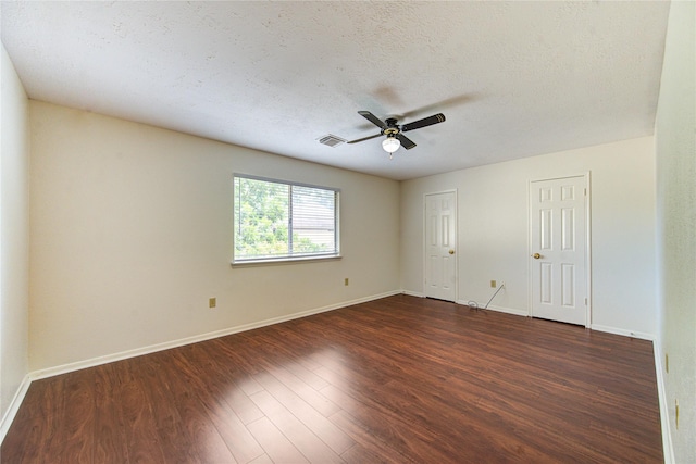 14823 Atterbury Dr, Sugar Land, TX 77498 - unfurnished room featuring dark wood-type flooring, a ceiling fan, baseboards, and a textured ceiling
