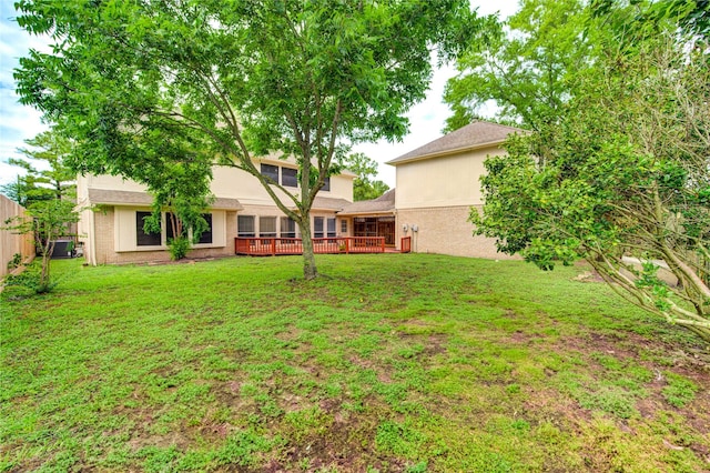 14823 Atterbury Dr, Sugar Land, TX 77498 - view of yard featuring a wooden deck and cooling unit