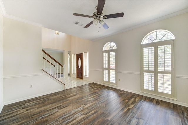 14823 Atterbury Dr, Sugar Land, TX 77498 - unfurnished living room featuring wood finished floors, stairs, ceiling fan, baseboards, and ornamental molding