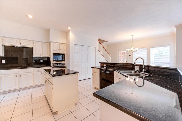 14823 Atterbury Dr, Sugar Land, TX 77498 - kitchen featuring black appliances, a sink, a kitchen island, a chandelier, and decorative backsplash