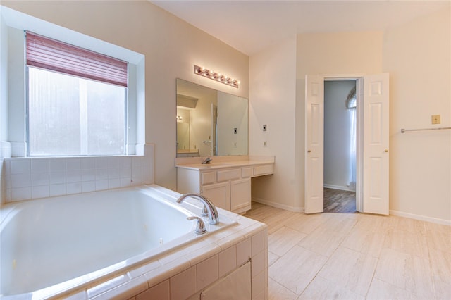 14823 Atterbury Dr, Sugar Land, TX 77498 - full bath featuring vanity, a bath, and baseboards