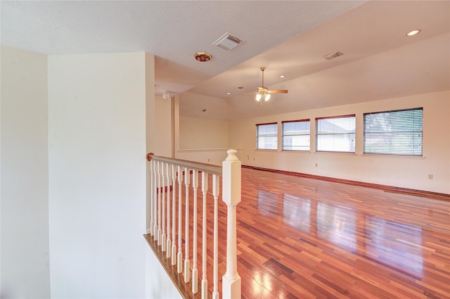 14823 Atterbury Dr, Sugar Land, TX 77498 - corridor featuring wood finished floors, an upstairs landing, recessed lighting, and baseboards