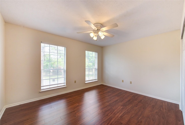 14823 Atterbury Dr, Sugar Land, TX 77498 - empty room featuring ceiling fan, dark wood-style flooring, and baseboards