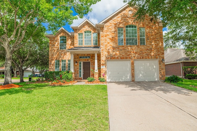 20314 Nellie Gail Trail Ln, Katy, TX 77450 - traditional home with concrete driveway, brick siding, a front yard, and a garage