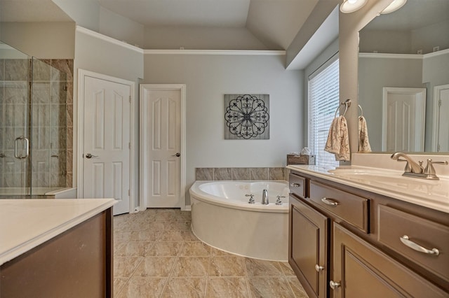15 Watermint Pl, The Woodlands, TX 77384 - bathroom with vanity, a stall shower, a bath, lofted ceiling, and tile patterned flooring