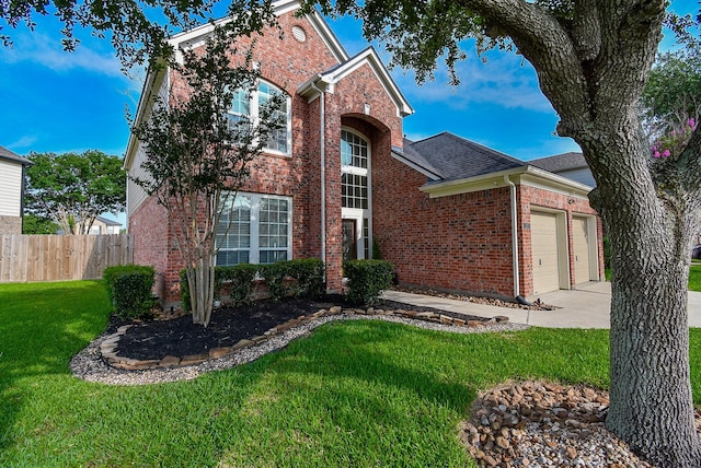 2803 Lakecrest Way Dr, Katy, TX 77493 - traditional-style home featuring brick siding, a garage, driveway, and roof with shingles