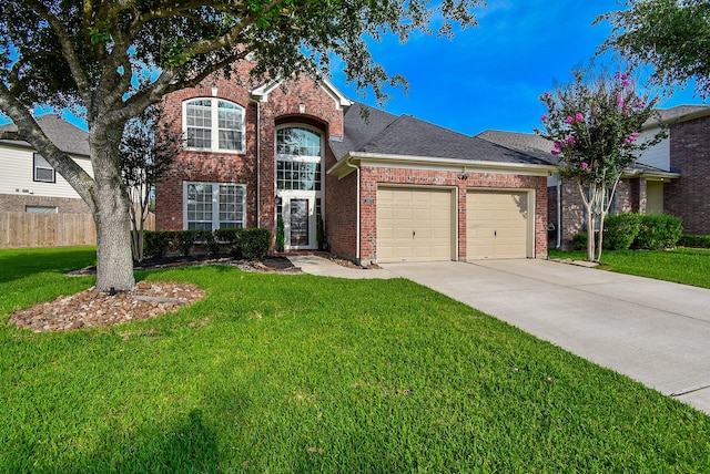 2803 Lakecrest Way Dr, Katy, TX 77493 - traditional home with an attached garage, driveway, brick siding, and a shingled roof