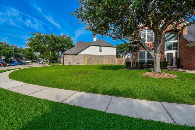 2803 Lakecrest Way Dr, Katy, TX 77493 - view of home's exterior featuring a chimney
