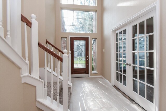 2803 Lakecrest Way Dr, Katy, TX 77493 - entrance foyer featuring healthy amount of natural light, french doors, stairs, and a high ceiling