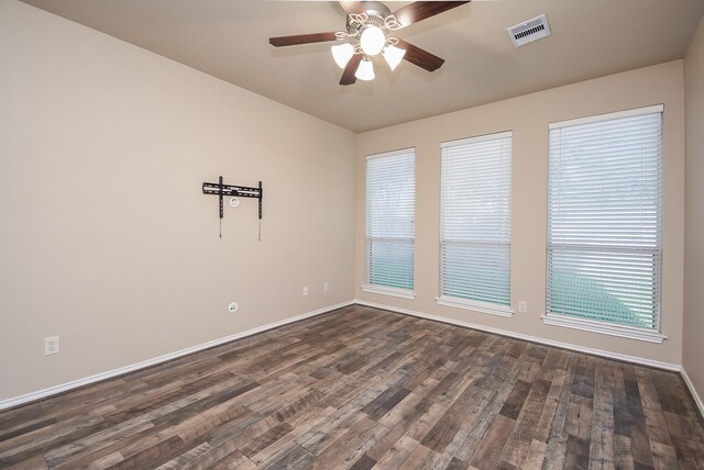 2803 Lakecrest Way Dr, Katy, TX 77493 - spare room with dark wood-style floors, ceiling fan, and baseboards