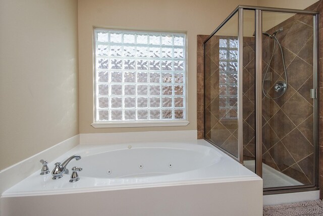 2803 Lakecrest Way Dr, Katy, TX 77493 - bathroom with healthy amount of natural light and a whirlpool tub
