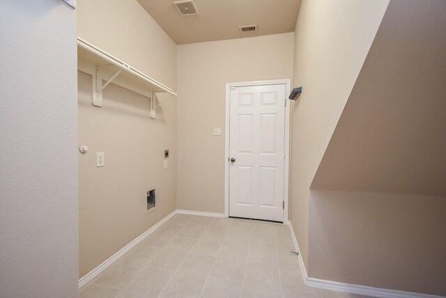 2803 Lakecrest Way Dr, Katy, TX 77493 - laundry room with electric dryer hookup, baseboards, and light tile patterned flooring