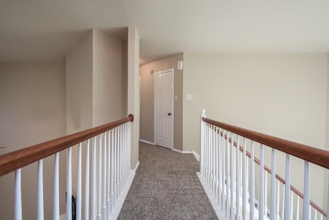 2803 Lakecrest Way Dr, Katy, TX 77493 - corridor featuring carpet flooring, baseboards, and an upstairs landing