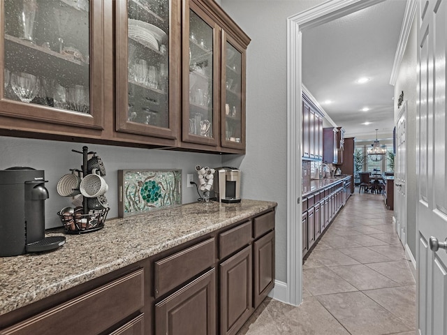 12118 Pinelands Park Ln, Humble, TX 77346 - bar area featuring light tile patterned floors, crown molding, and recessed lighting