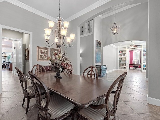 12118 Pinelands Park Ln, Humble, TX 77346 - dining area featuring arched walkways, a chandelier, ornamental molding, light tile patterned flooring, and a ceiling fan