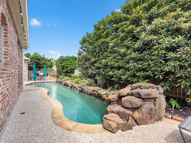 12118 Pinelands Park Ln, Humble, TX 77346 - view of pool featuring a fenced backyard and a patio area