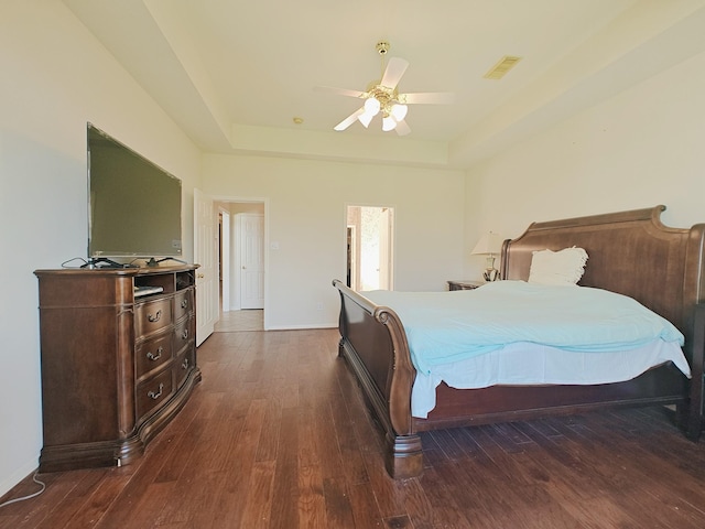2631 Misty Grove Dr, Manvel, TX 77578 - bedroom with a raised ceiling, wood finished floors, baseboards, and a ceiling fan