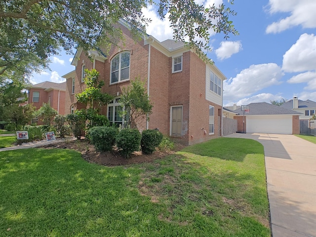 2631 Misty Grove Dr, Manvel, TX 77578 - view of side of home with brick siding, a garage, and concrete driveway