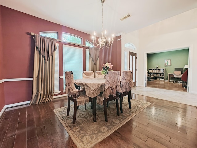 2631 Misty Grove Dr, Manvel, TX 77578 - dining space with a chandelier, wood-type flooring, and baseboards