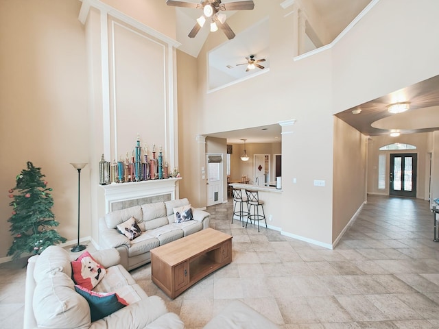2631 Misty Grove Dr, Manvel, TX 77578 - living area with a ceiling fan, baseboards, and a high ceiling