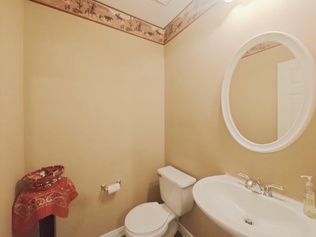 2631 Misty Grove Dr, Manvel, TX 77578 - bathroom with a sink, toilet, and baseboards