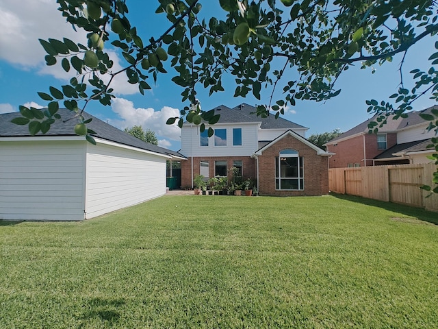 2631 Misty Grove Dr, Manvel, TX 77578 - rear view of house with brick siding and an outbuilding
